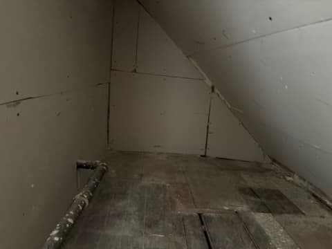 During: taping seams on the gable ceiling.