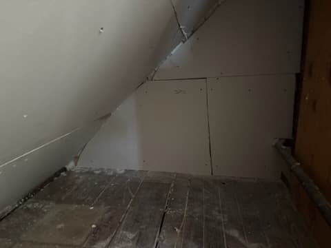During: taping and skim coating the attic walls.