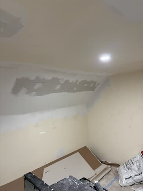 During: painting trim in the attic.