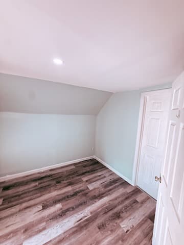 After: the attic room with drywall painted and finished.