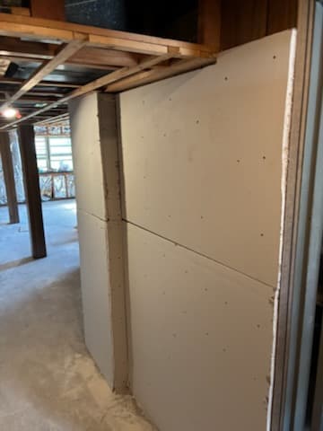 During: sistering new studs onto the basement framing.