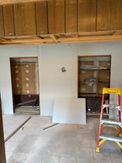 After: the basement's painted walls and ceiling.
