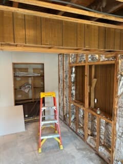 After: the finished basement ceiling and painted walls.