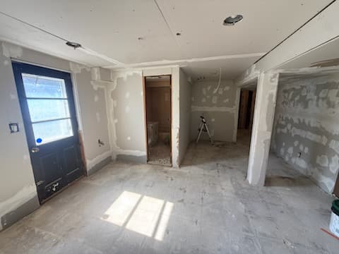 During: priming the new drywall in the basement.