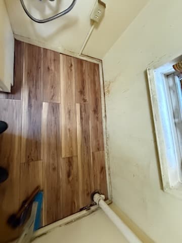 After: finished plank flooring in the kitchen.